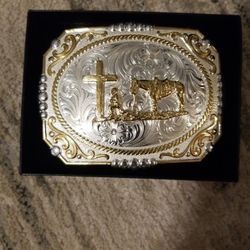 Belt Buckle.  Cowboy & Horse At The Cross. Montana Silversmiths. 