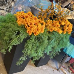 Two large decorative fake plants