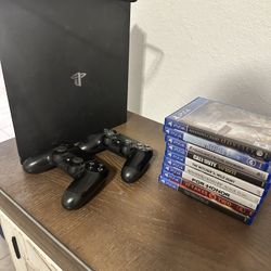 PS4 Plus Two Remotes And A Bundle Of Games And Rock Band With Drums And Guitar 