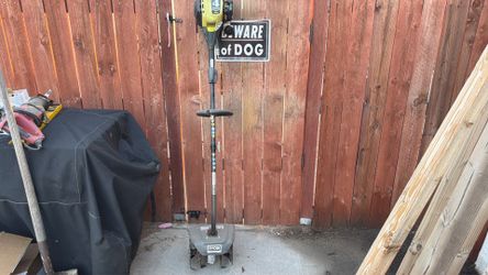 Gas powered Ryobi weed eater with expand it cultivator