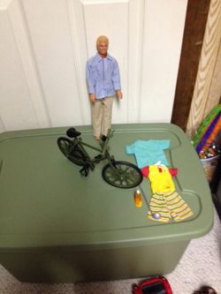 Ken doll and bike