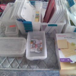 Lots Of Plastic Containers With Lids For All Of Them 