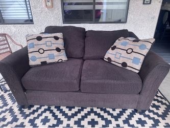 Brown love seat couch