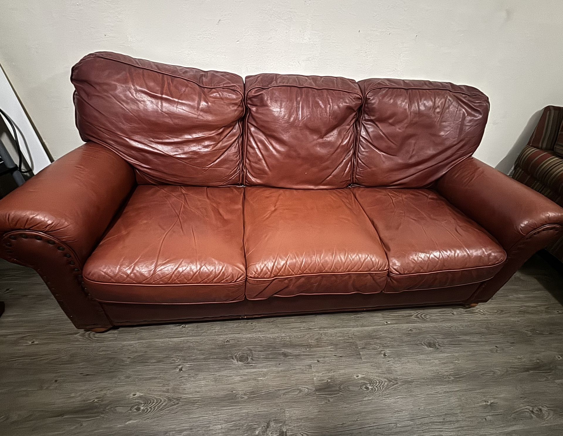 Leather Burgundy Couch with Button Designs