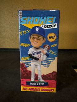 Shohei Ohtani carrying his dog bobble head