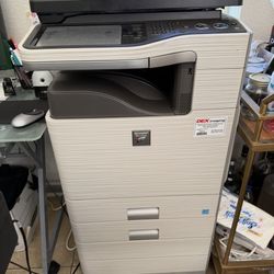 Sharp MX-C311, which is a color laser multifunction printer.