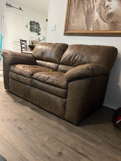 Genuine leather love seat $100 or Best Offer .
