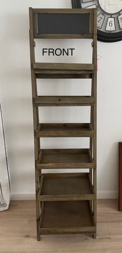 Rustic farmhouse-style wooden ladder shelf