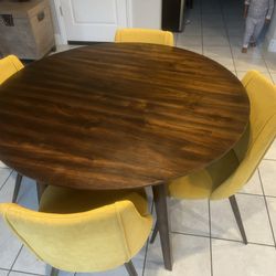 Modern Brown Table With Yellow Chairs 