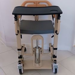 Hydraulic lift transport commode chair, adjustable yellow steel, with footrest and dining tray, 200 kg capacity, 4 wheels,