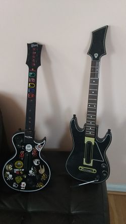 Wireless guitar controller ones for PS3 the one on right and left is for Xbox