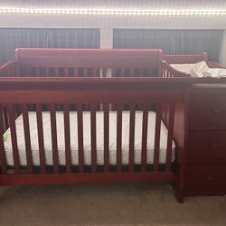Wooden Crib With Attaches Drawers And Shelves 
