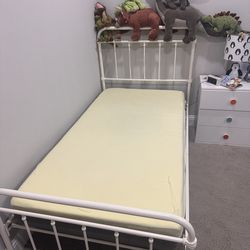 Twin metal bed with IKEA mattress