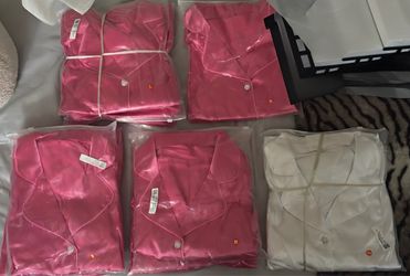 — Hot pink polyester two-piece pajama set including a long-sleeve button-up top with matching shorts with a drawstring waist. Brand new . Sizes S,M,L&