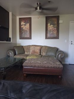 Set up with table and pictures moving in a week couch need cleaning
