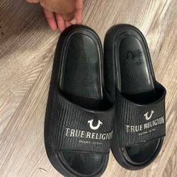 (black slide sandals from True Religion Brand.)