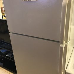 GE” White Refrigerator 