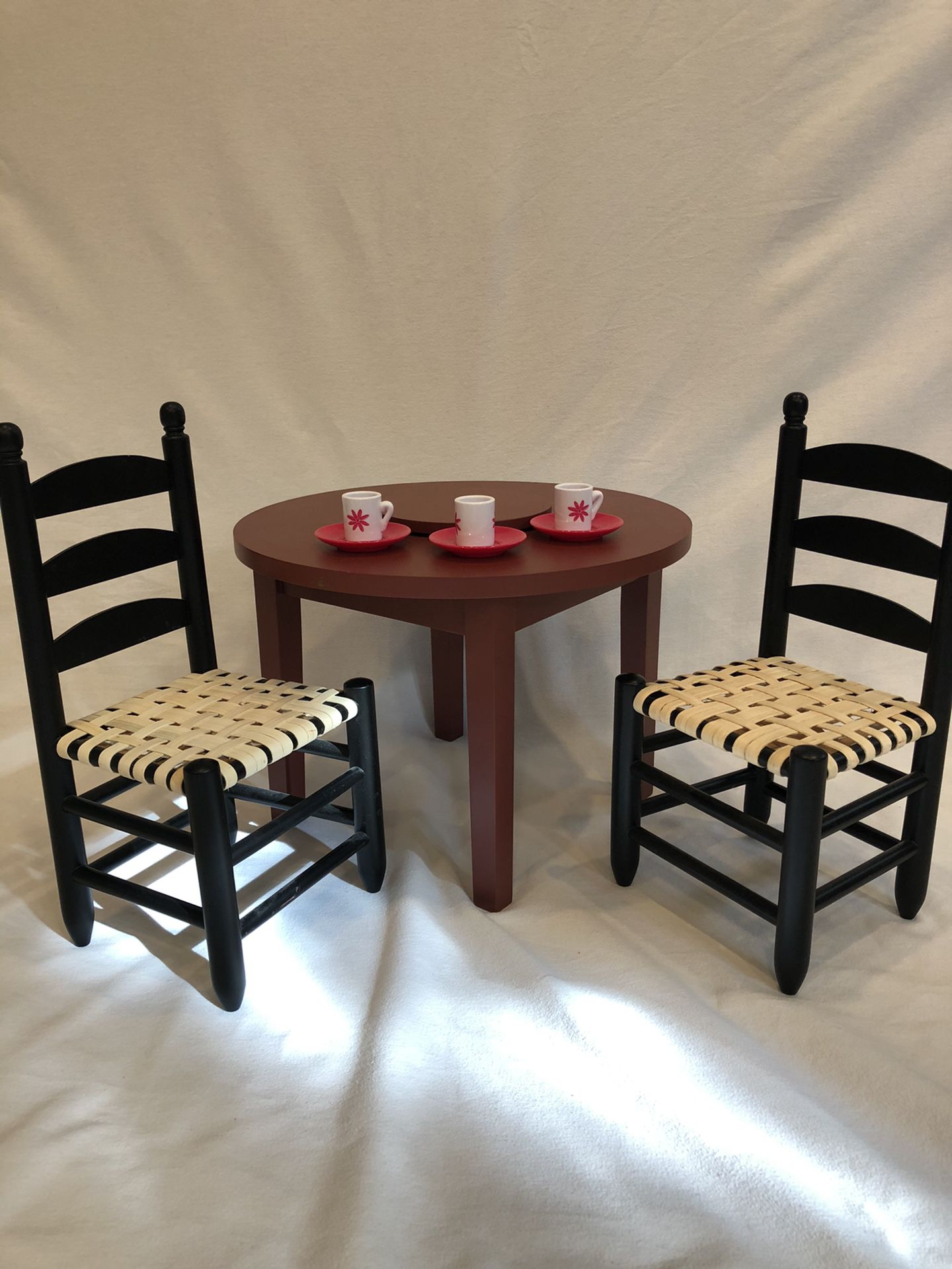 American Girl Doll dining table, two wicker chairs, with lazy Susan, tea cups, and saucers. Excellent condition. Barely used.