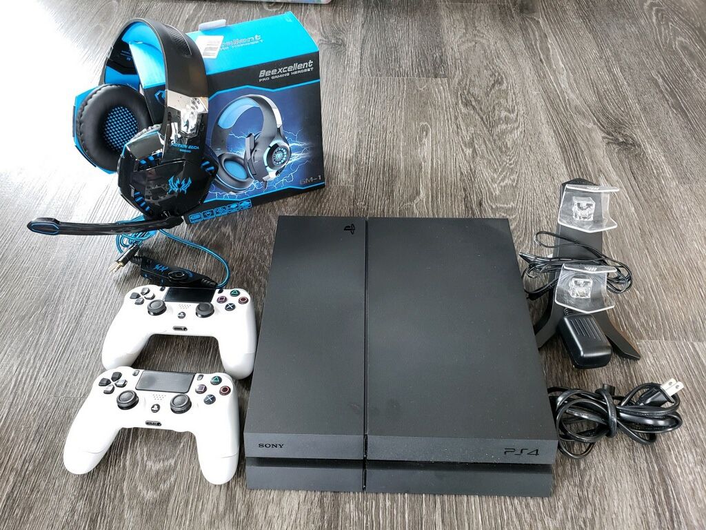 Sony PS4, 2 Wireless Controllers, 5 games, Charging Station, and Headset