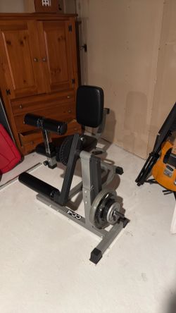 Leg curl extension machine