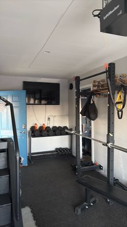 Rogue Fitness Monster Lite Folding Wall-Mount Squat Rack – $400.00