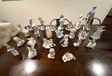 24 various Lladro figurines.
