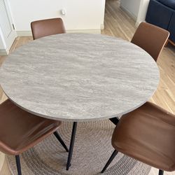 Table and 4 faux leather chairs