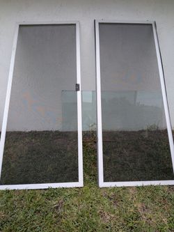White aluminum sliding patio screen doors. Price for both. Other Available Items On This Account.