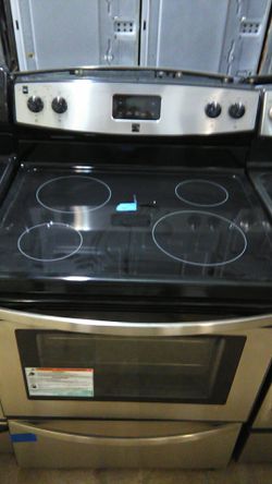 Like New Kenmore stainless steel stove's one year warranty delivery available