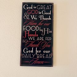Rustic wooden sign with the traditional "God is Great, God is Good" dinner prayer. 