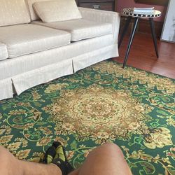 Green rug off white Sofa 