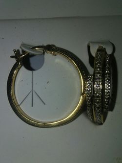 18 k over earring. Real stone