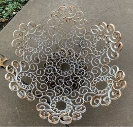 This is a vintage MCM Gothic wrought iron scroll bowl featuring a rustic, spiral design with visible oxidation.