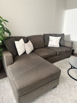 Living Spaces dark grey charcoal sectional couch