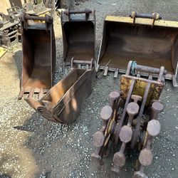 Caterpillar Backhoe Buckets And Compaction Wheel