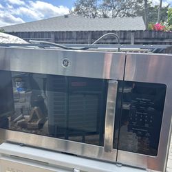 GE stainless over the range microwave almost new