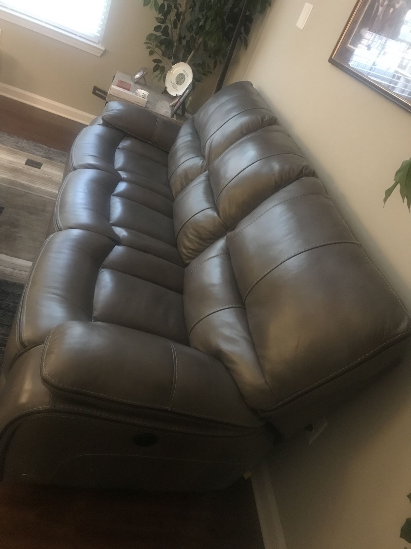 Cindy Crawford Home Gianna grey leather glider sofa and recliner.