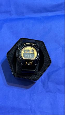 Black and yellow G shock watch