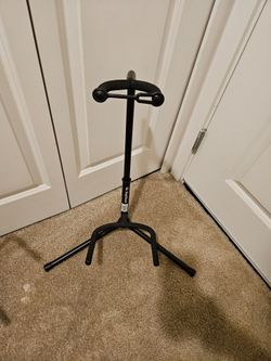 Folding guitar stands