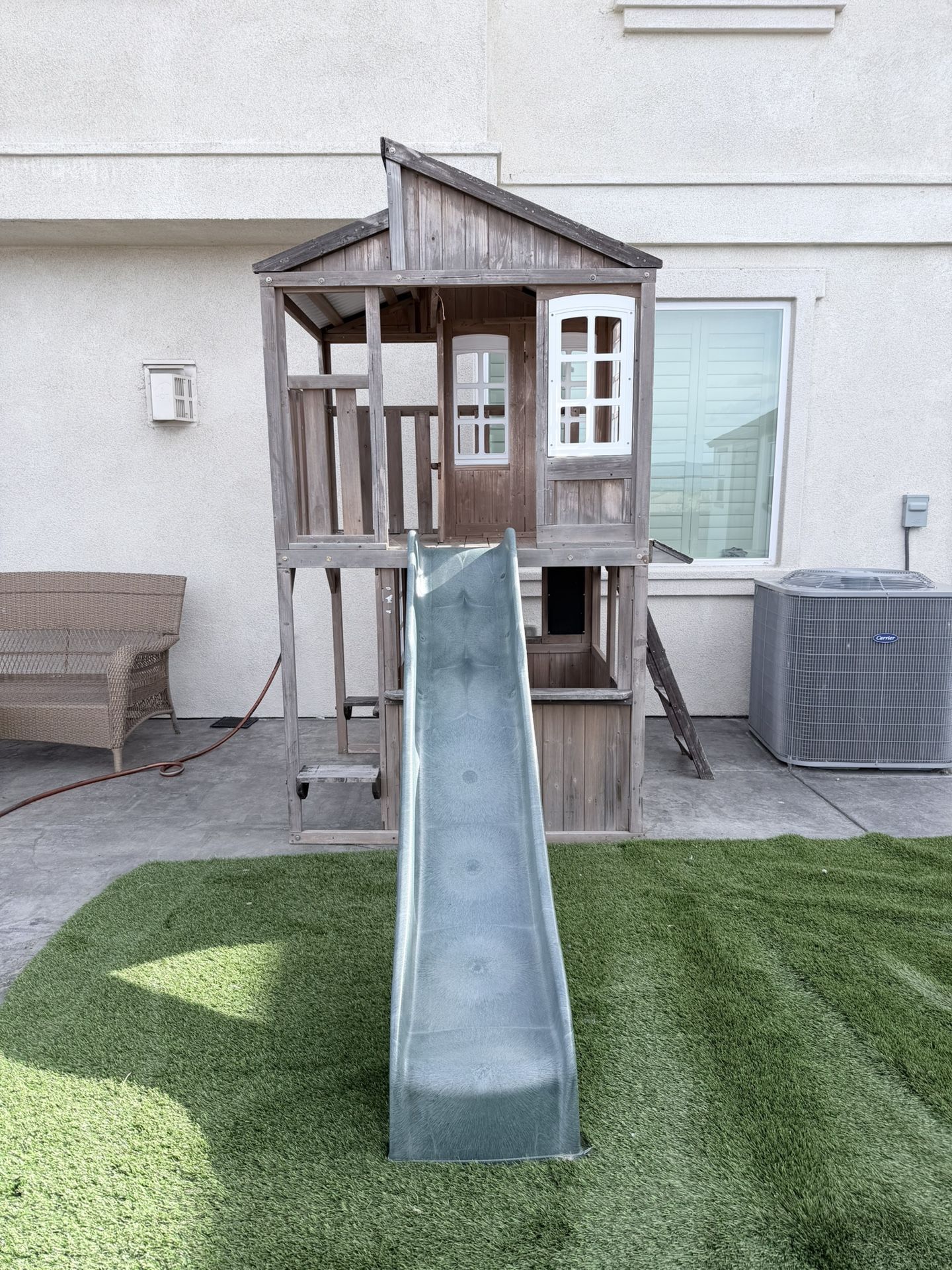 Two-story wooden playhouse