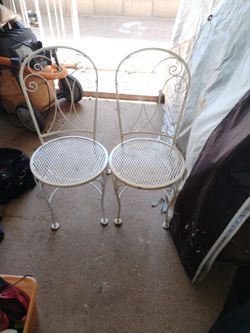 (2) Wrought Iron  Chairs  Going. Cheap