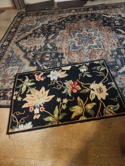 Two carpets. One big one small. Large is print on synthetic good condition Small is wool Safavieh