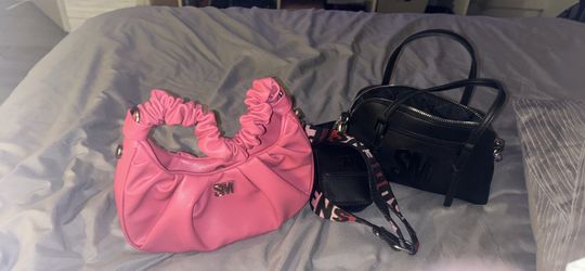 pink and black steve madden purses