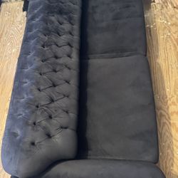 black tufted couch 