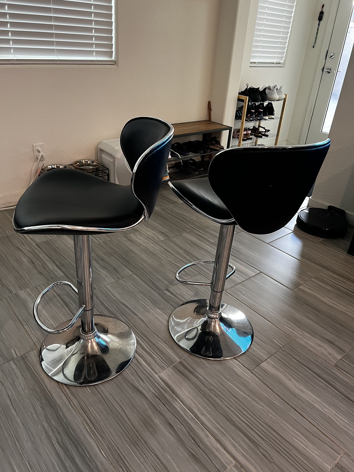 Black adjustable bar stools (sold as a pair)