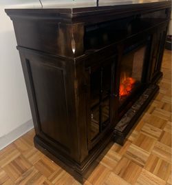 Ashley Furniture TV Stand w/ Electric Fireplace & Heater”.