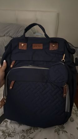 Diaper bag with changing station