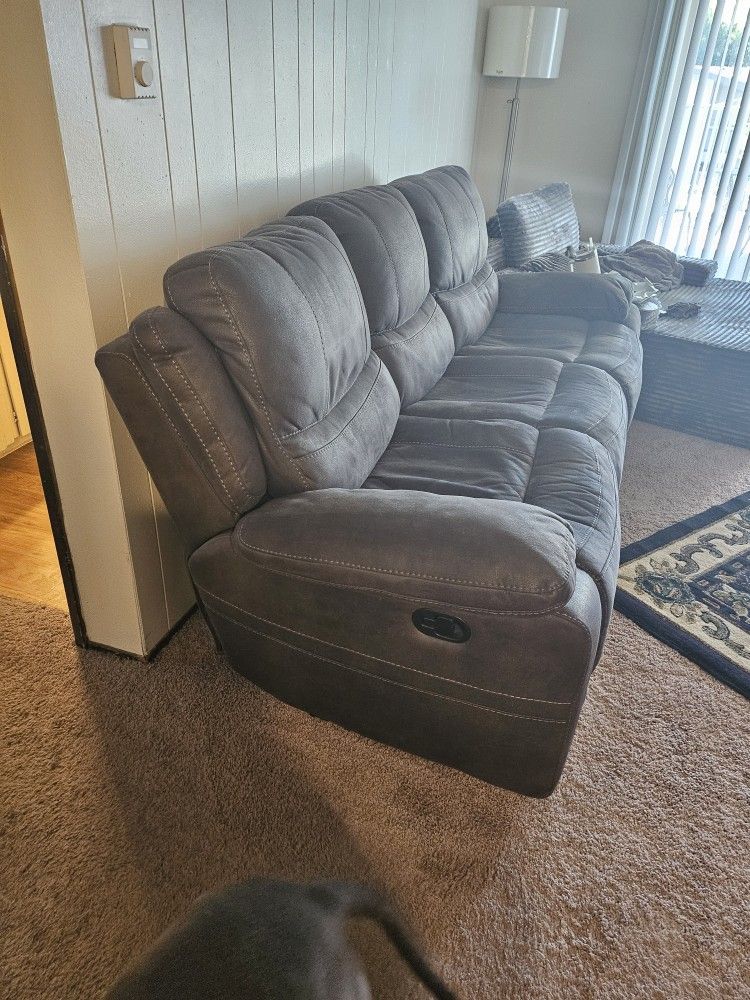 Barely used couch with two recliners