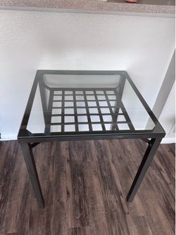 Dining table with glass on top, good condition.