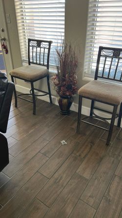 Two High Rod Iron Chairs